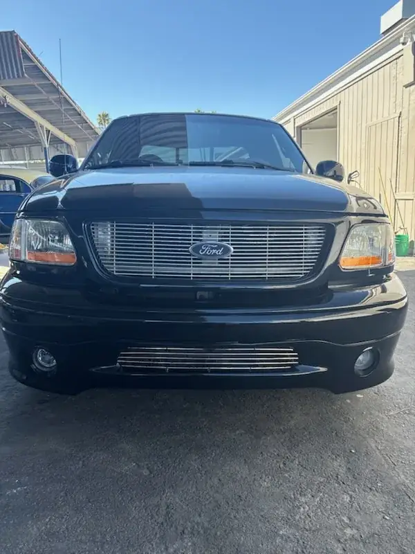 After: front view of the 2000 Ford F150 Harley-Davidson Edition with new front bumper assembly and billet grille
