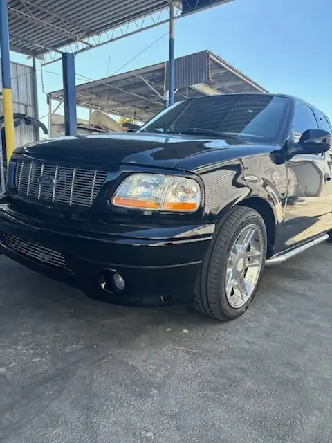 After: 2000 Ford F150 Harley-Davidson Edition left front after front-end repair, angled view