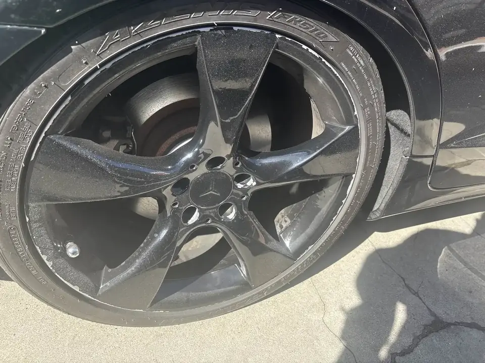 Before: damaged right rear wheel on a 2013 Mercedes-Benz CLS550
