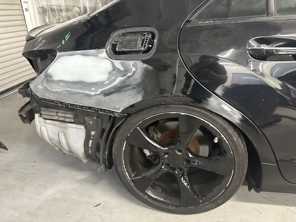 During: close-up of right quarter panel bodywork on a 2013 Mercedes-Benz CLS550