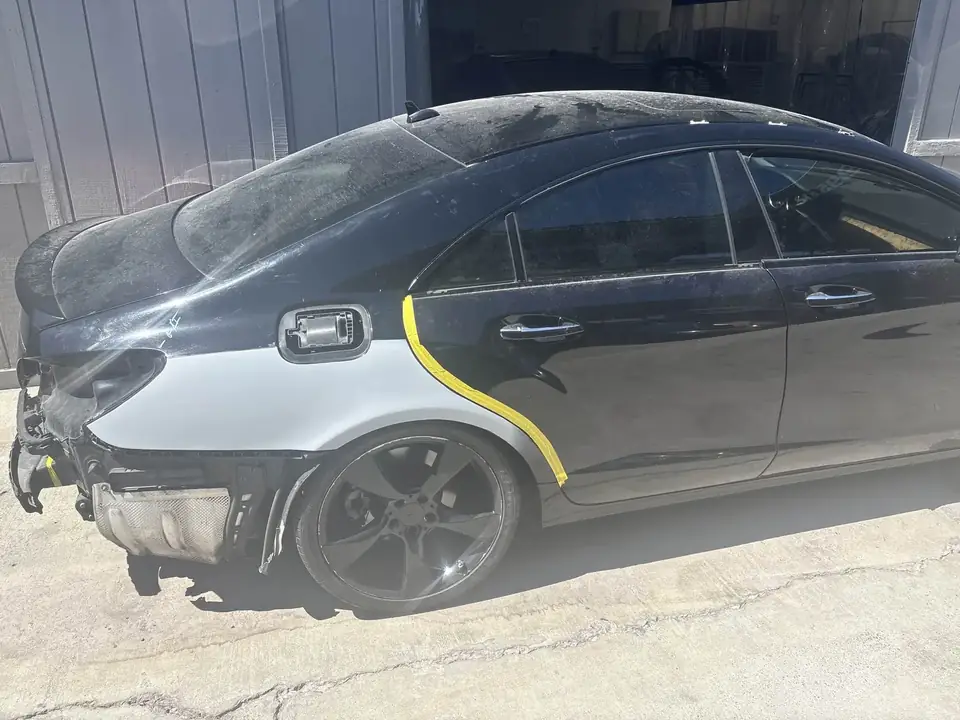 During: 2013 Mercedes-Benz CLS550 right side masked and primed for refinish