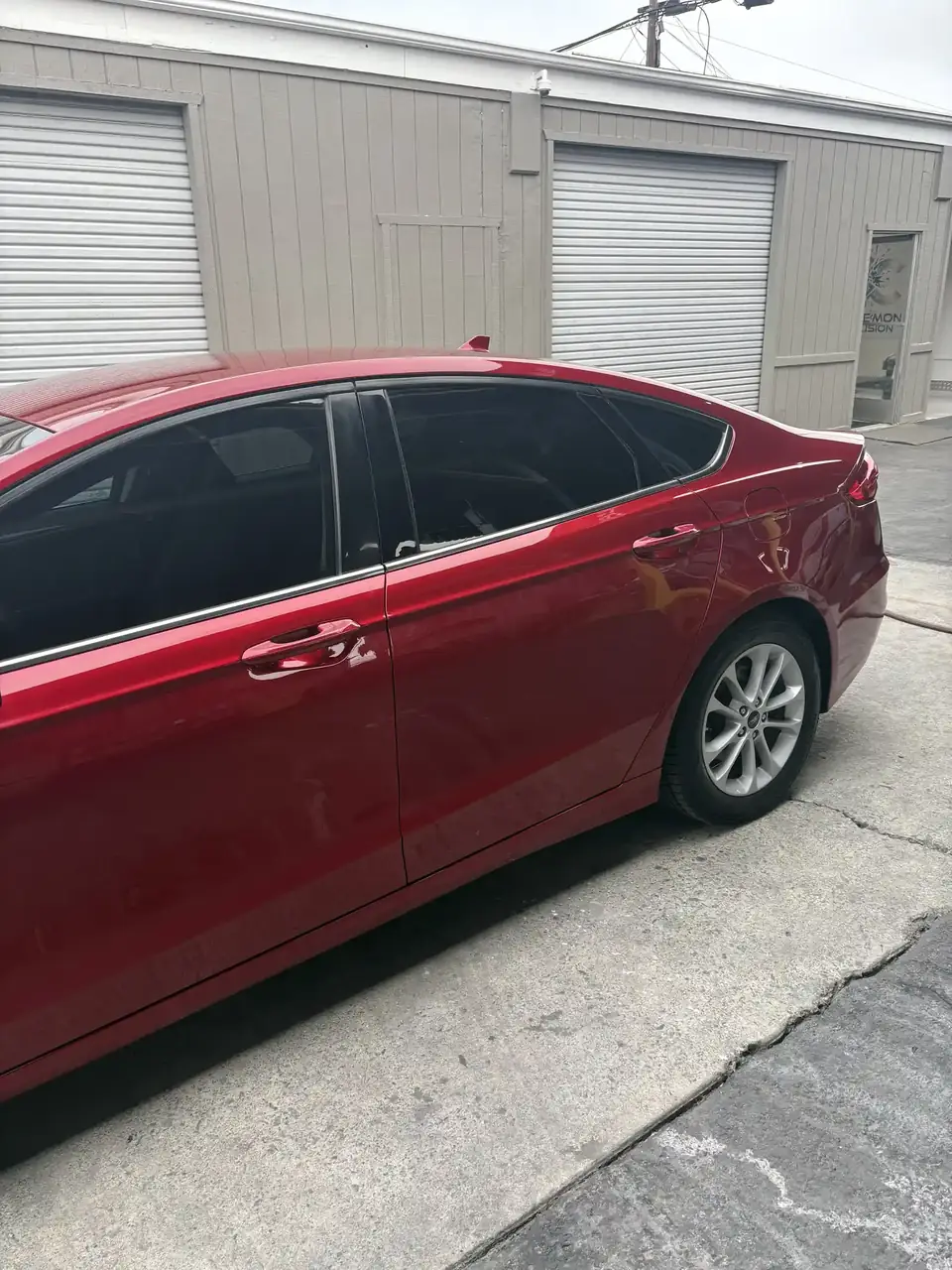 After: 2020 Ford Fusion left front three-quarter view after repair