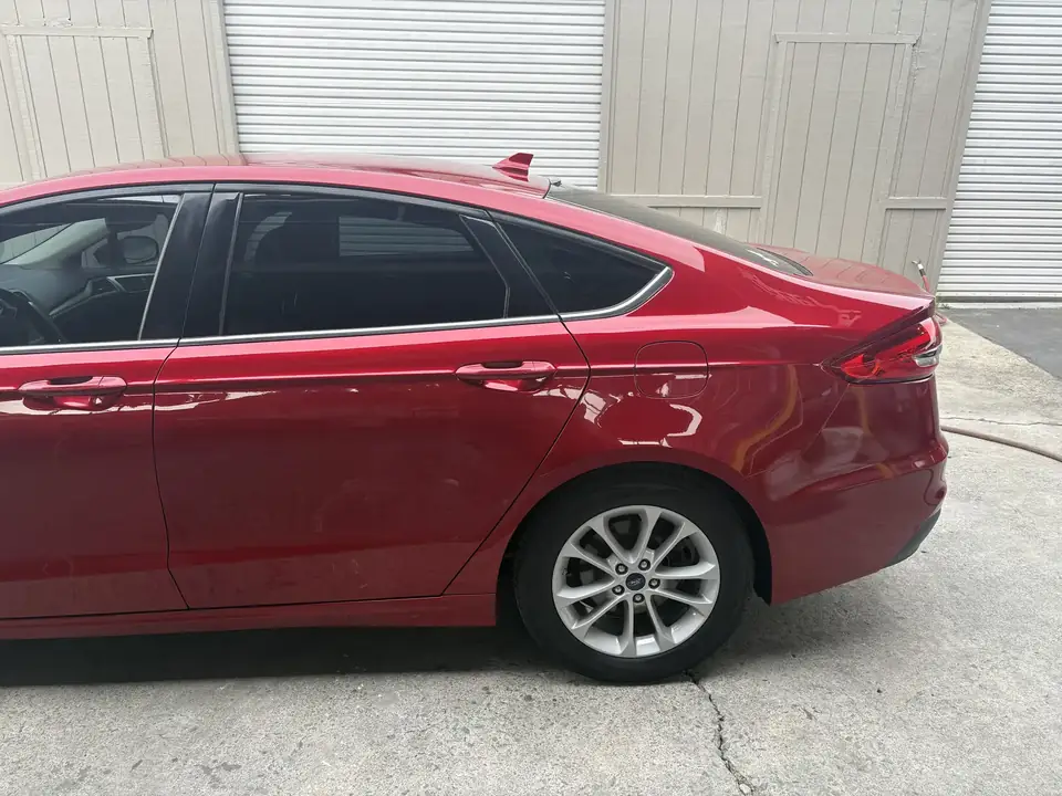 After: left rear door and quarter panel of the 2020 Ford Fusion after repair