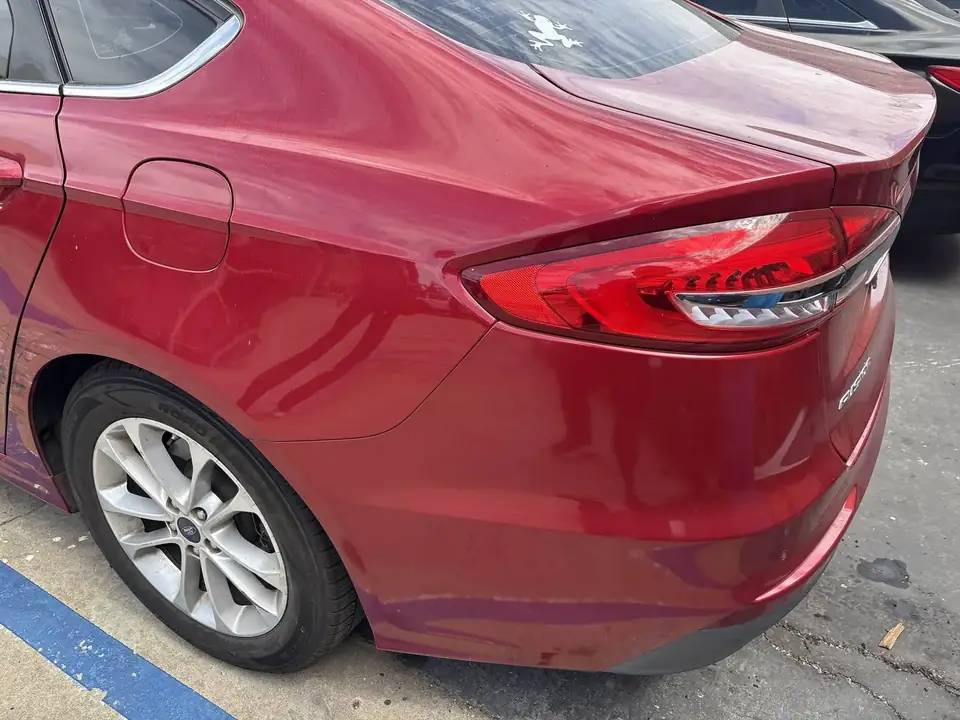 Before: left quarter panel and taillight area of the 2020 Ford Fusion