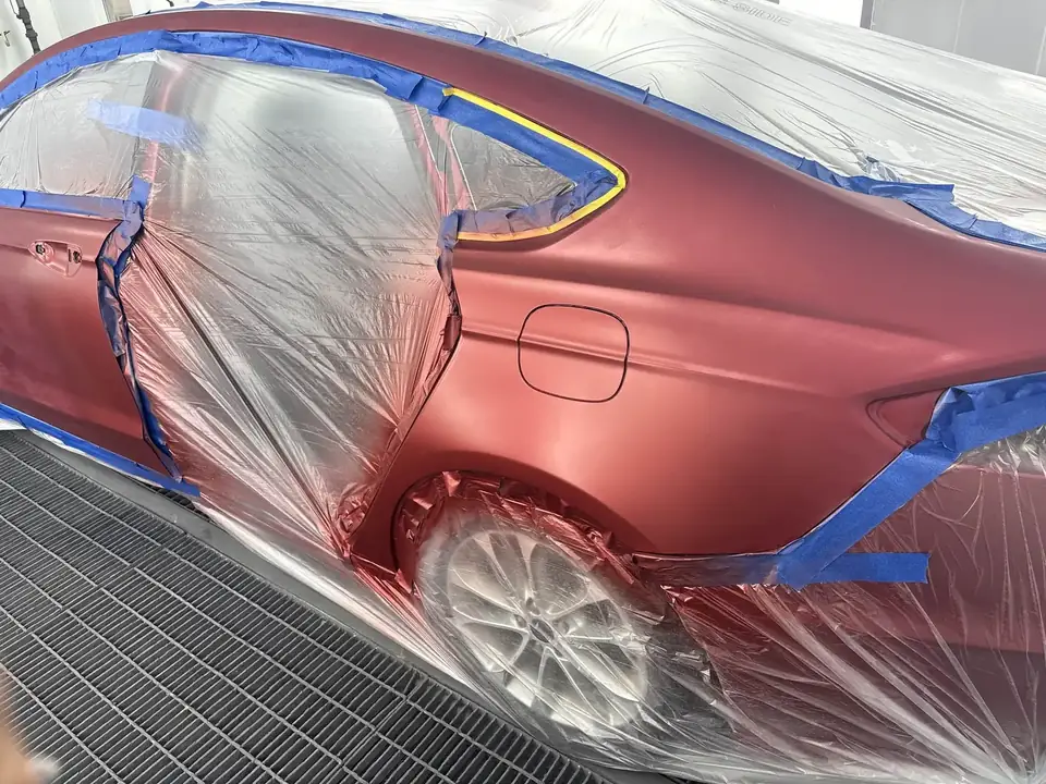 During: 2020 Ford Fusion left side masked for the three-stage candy apple red refinish