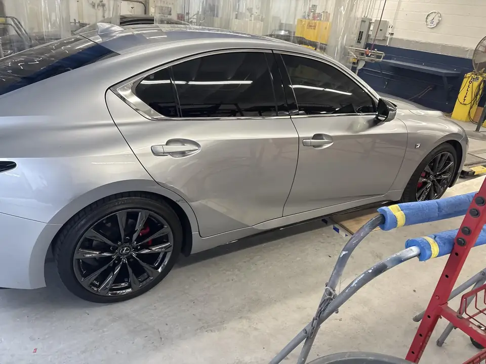 In the shop: right side profile of the 2023 Lexus IS350 F Sport showing the rear door and quarter panel