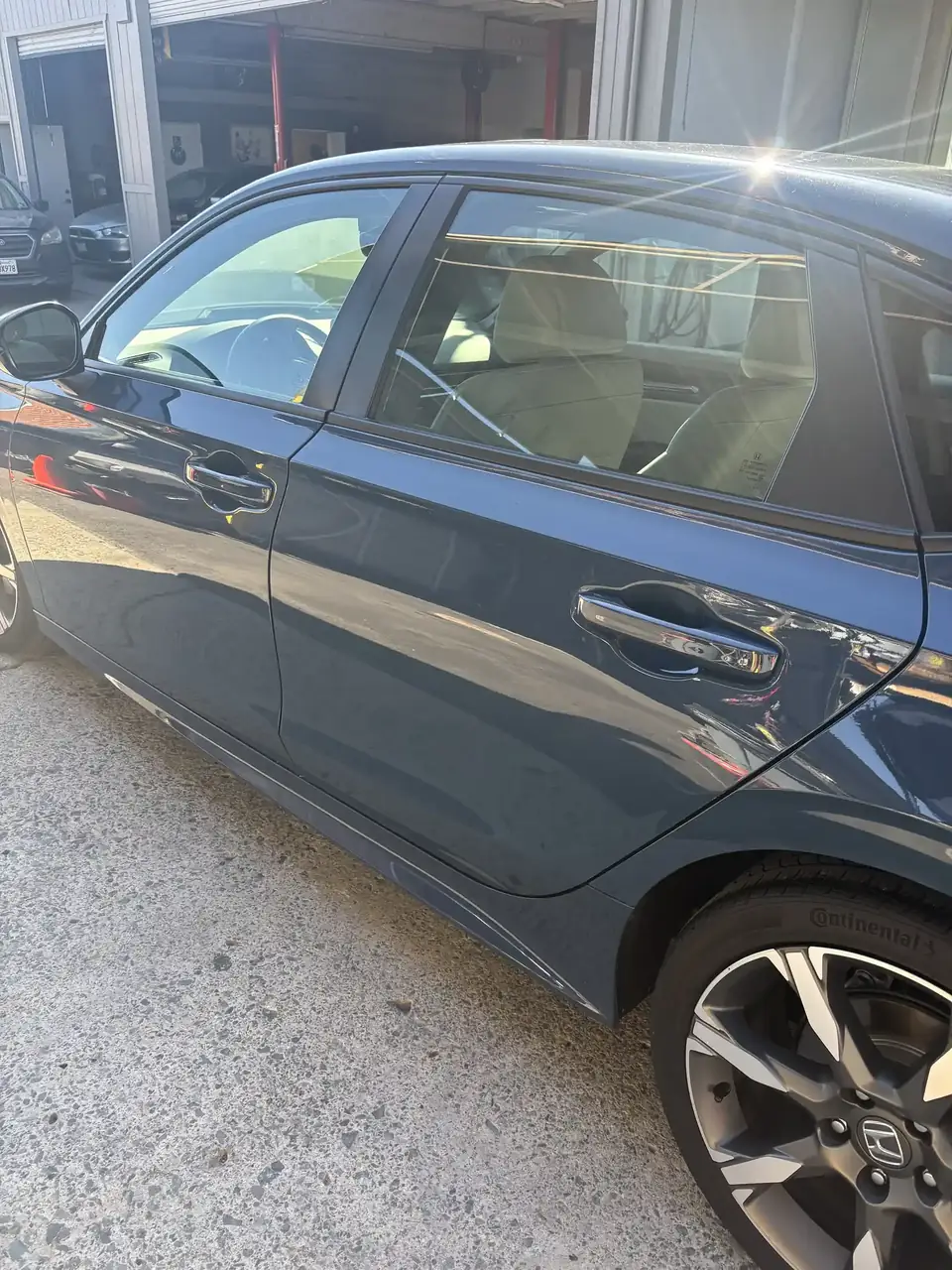 After: left side of the repaired 2025 Honda Civic, angled view