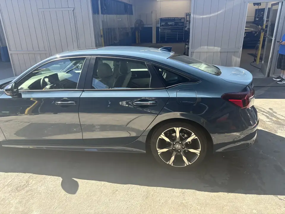 After: full left side profile of the 2025 Honda Civic after collision repair