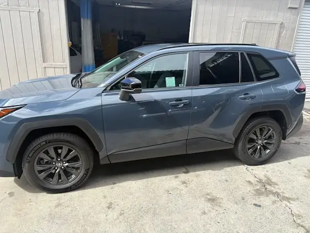 After: full left side profile of the 2026 Toyota RAV4 XLE after collision repair