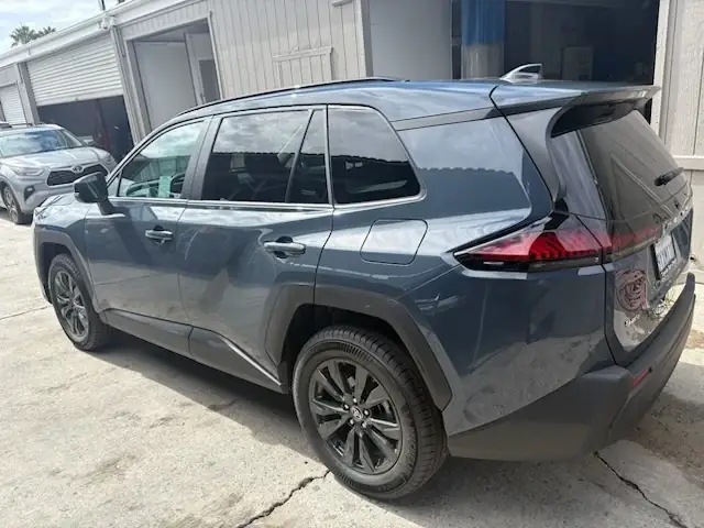 After: 2026 Toyota RAV4 XLE left rear door, quarter panel and rear bumper after repair, rear three-quarter view